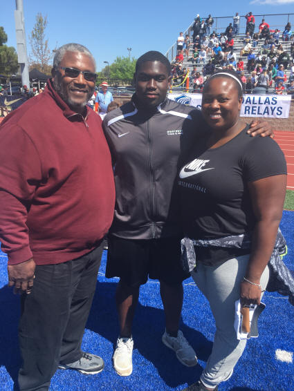 Gabe Oladipo with Michelle and Michael Carter